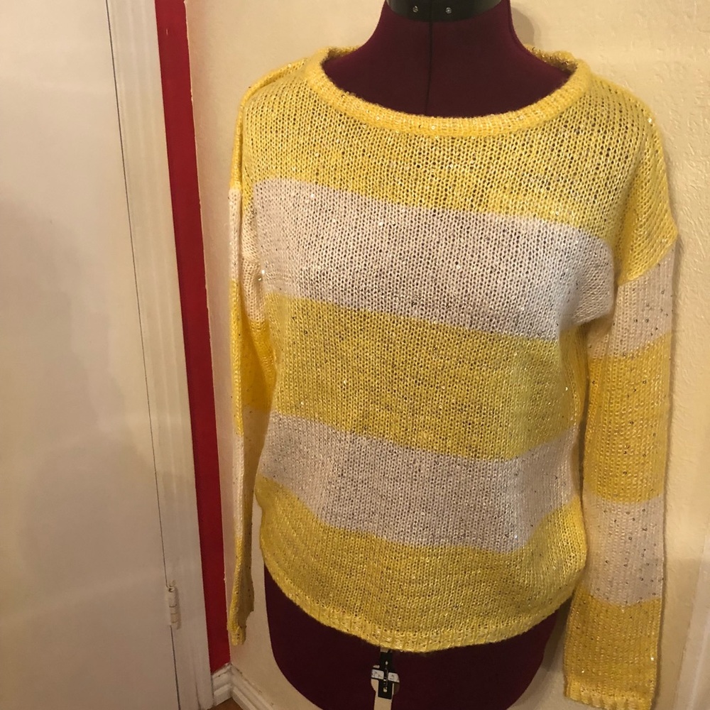 White and yellow sweater